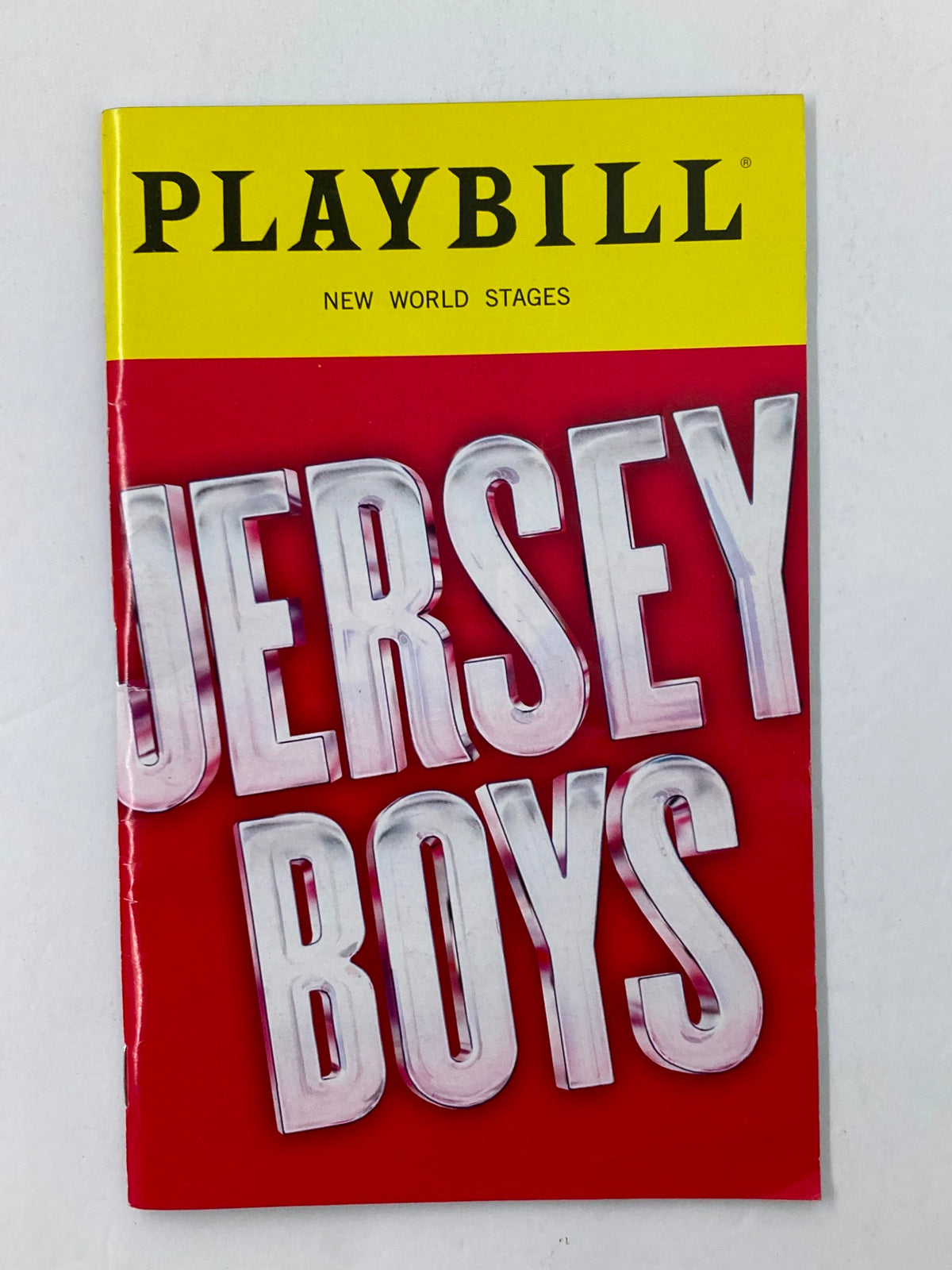 Cover of the 2018 Playbill New World Stages Jersey Boys featuring bold typography with the title 'Jersey Boys' prominently displayed, showcasing the iconic musical about Frankie Valli & the Four Seasons.
