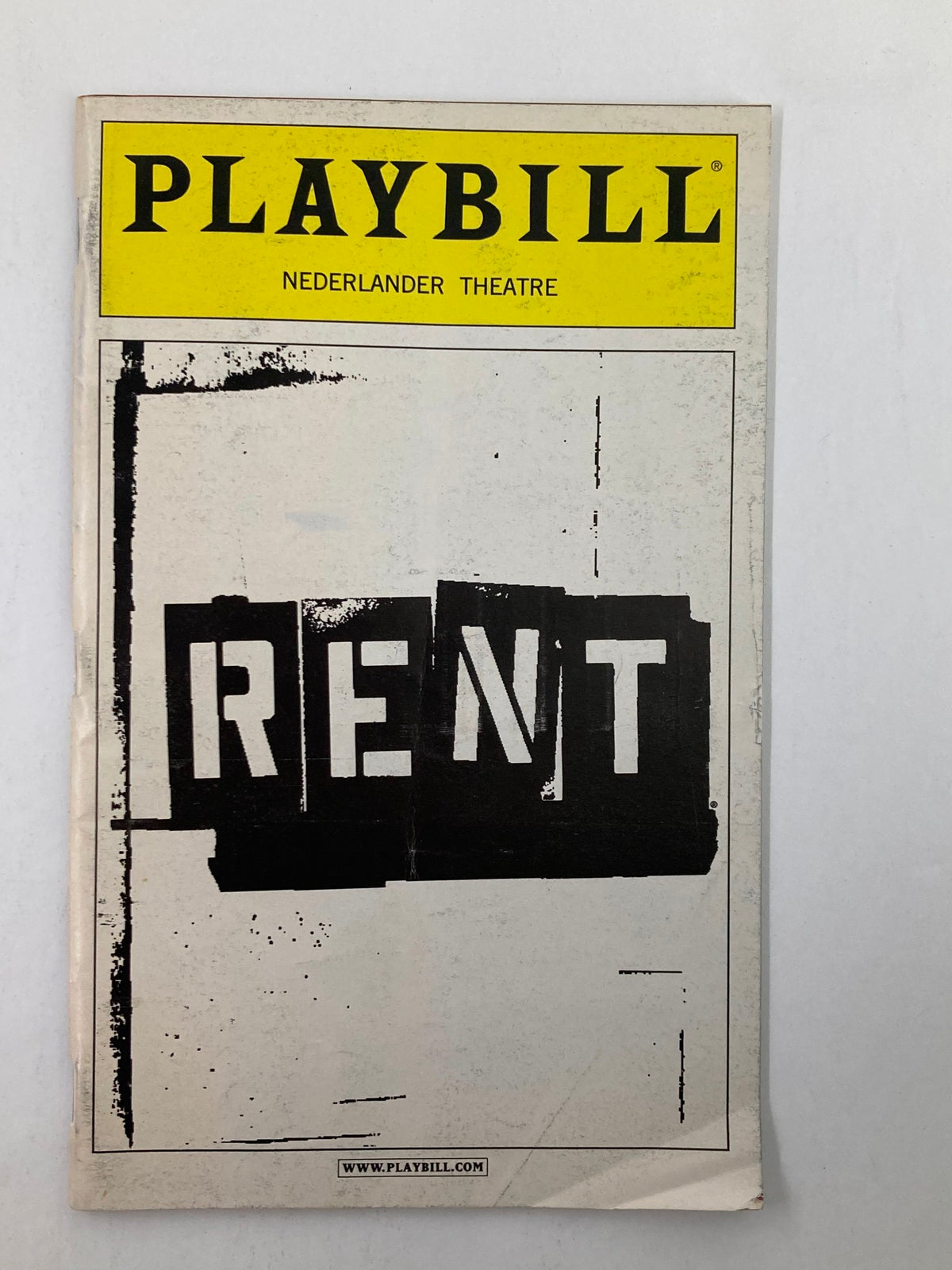 2003 Playbill from the Nederlander Theatre featuring the iconic musical Rent, showcasing its bold title design.