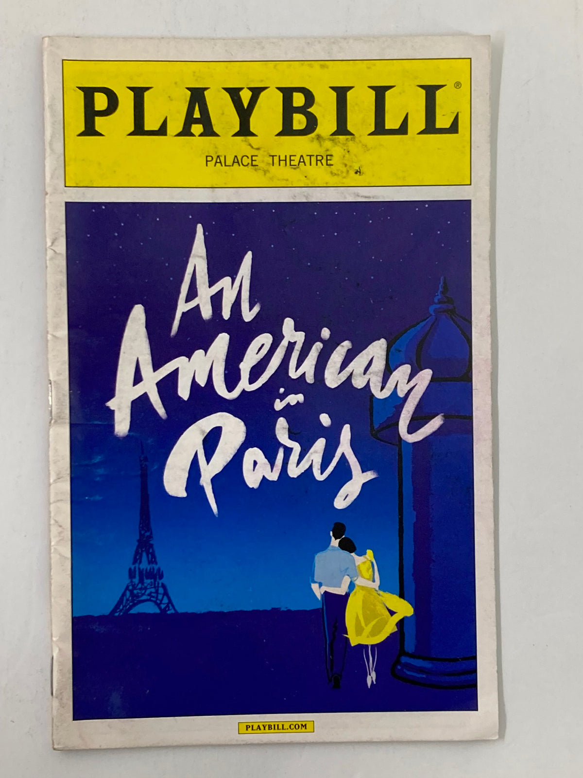 2015 Playbill for An American in Paris featuring vibrant cover art and iconic Eiffel Tower illustration.