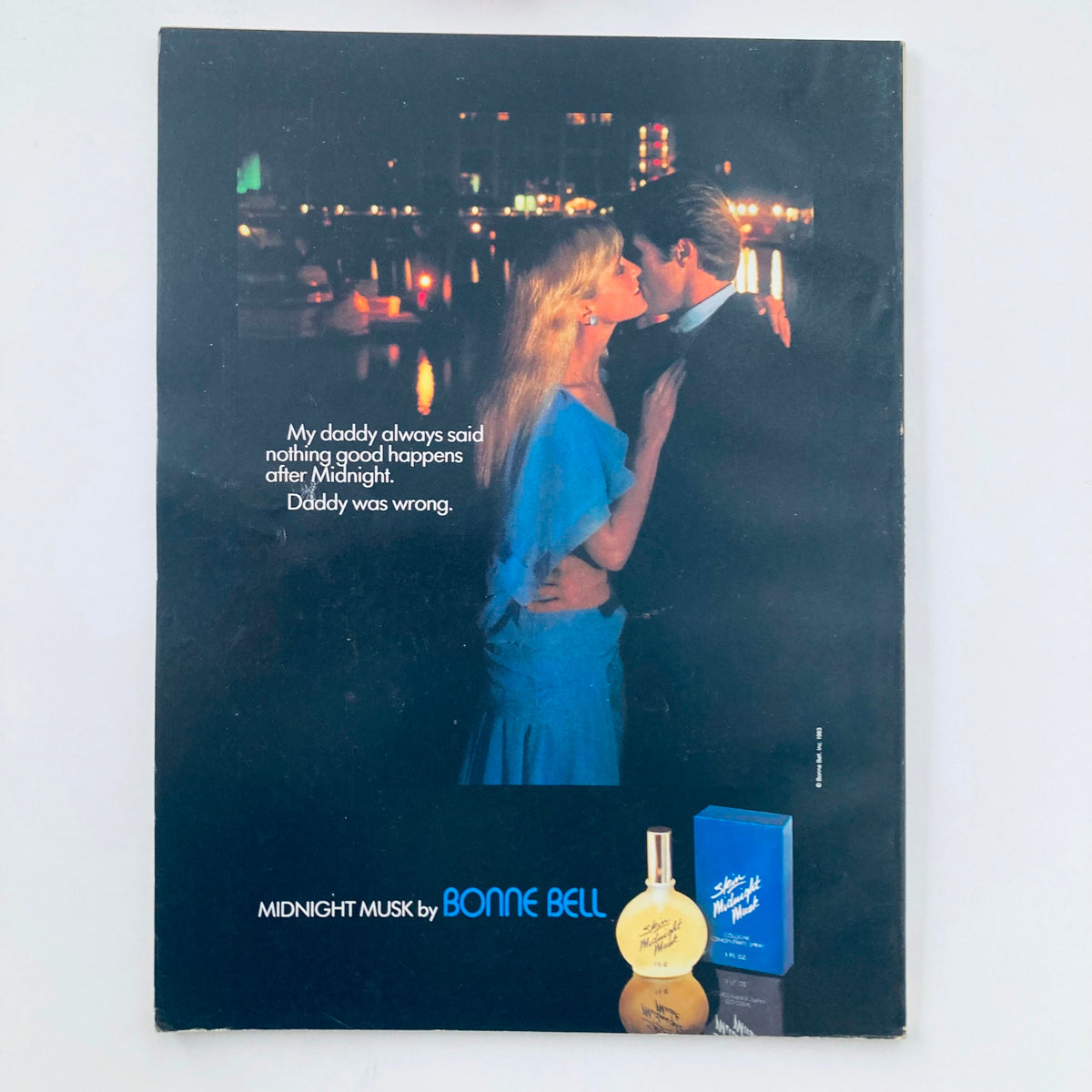 Back cover of VTG Seventeen Magazine January 1984 featuring an advertisement for Midnight Musk by Bonne Bell, with a romantic couple against a nighttime backdrop.