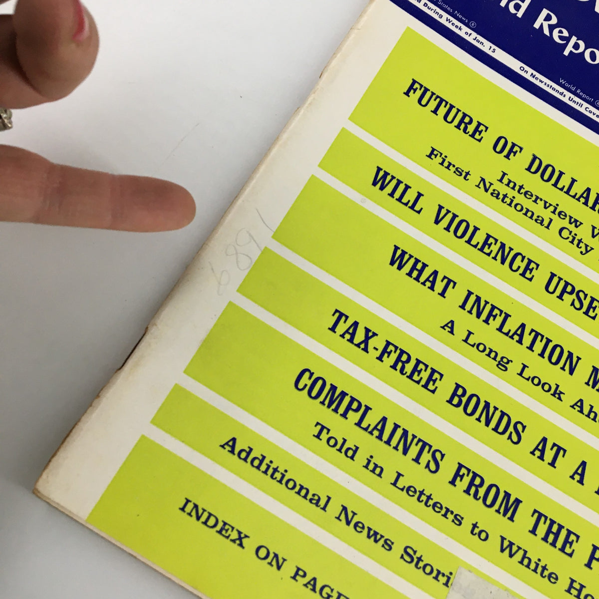 Close-up of the US News & World Report Magazine January 22, 1968 cover, featuring headlines on the future of the dollar, inflation, tax-free bonds, and other significant topics of the 1960s.