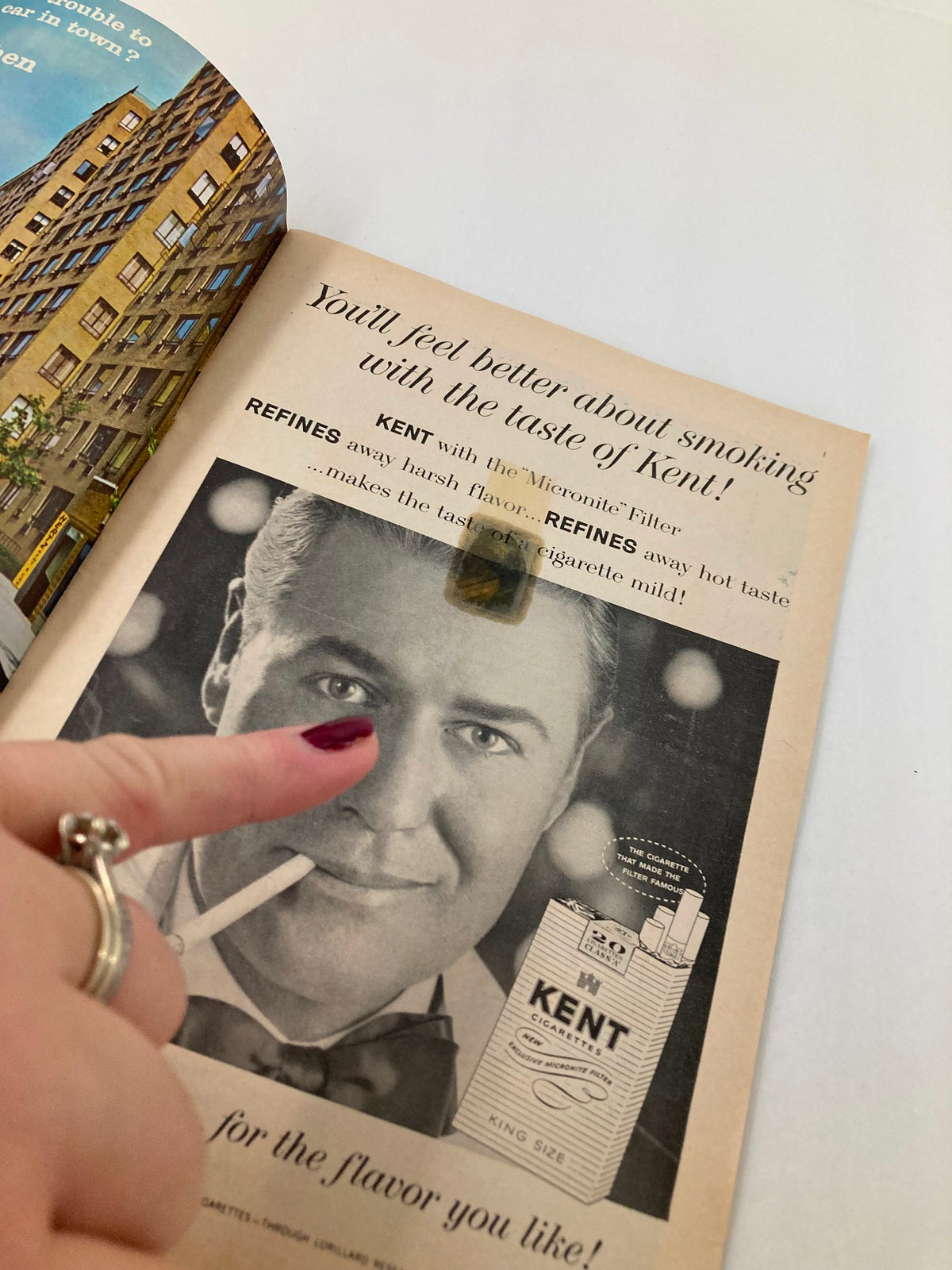 Vintage advertisement on the inside of a 1961 Playbill for Rhinoceros, featuring a man smoking a Kent cigarette with a spotlight on him.