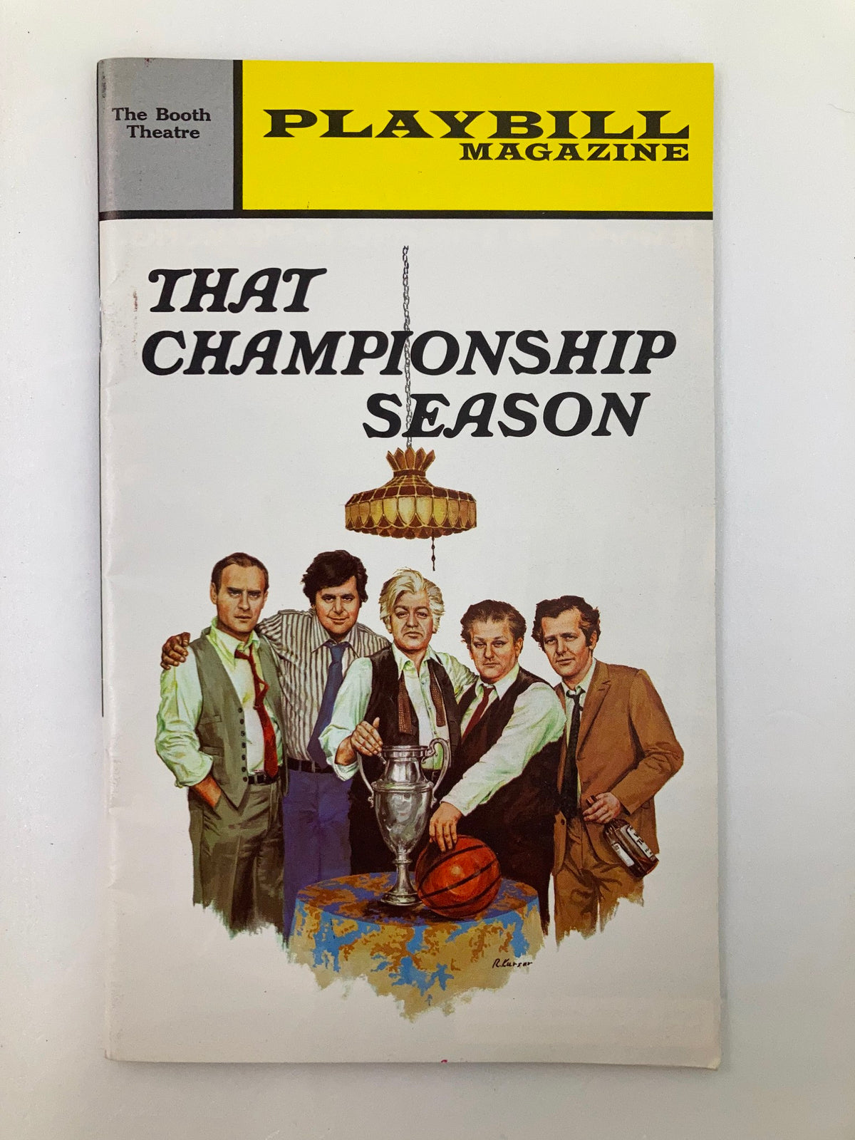 1961 Playbill for That Championship Season featuring the cast in a classic pose with a trophy at the Booth Theatre, showcasing iconic Broadway imagery.
