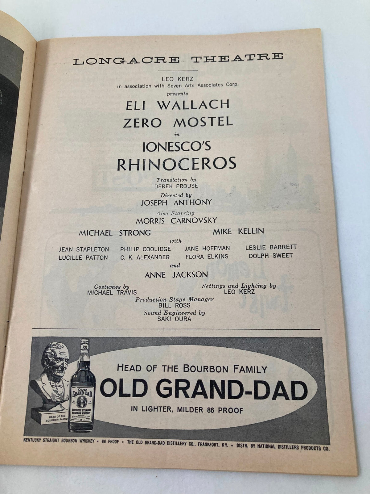 Page from the 1961 Playbill showcasing cast credits for Eli Wallach and Zero Mostel in 'Rhinoceros' at Longacre Theatre.
