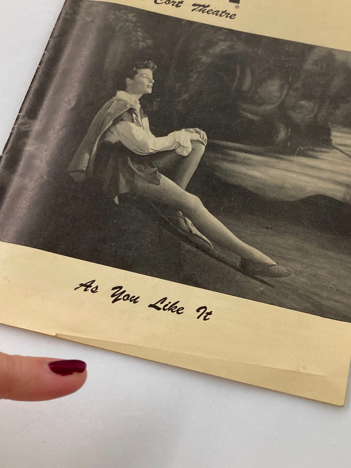 Close-up of the 1950 Playbill for The Cort Theatre titled 'As You Like It', highlighting the vintage design and an image of a performer in costume.