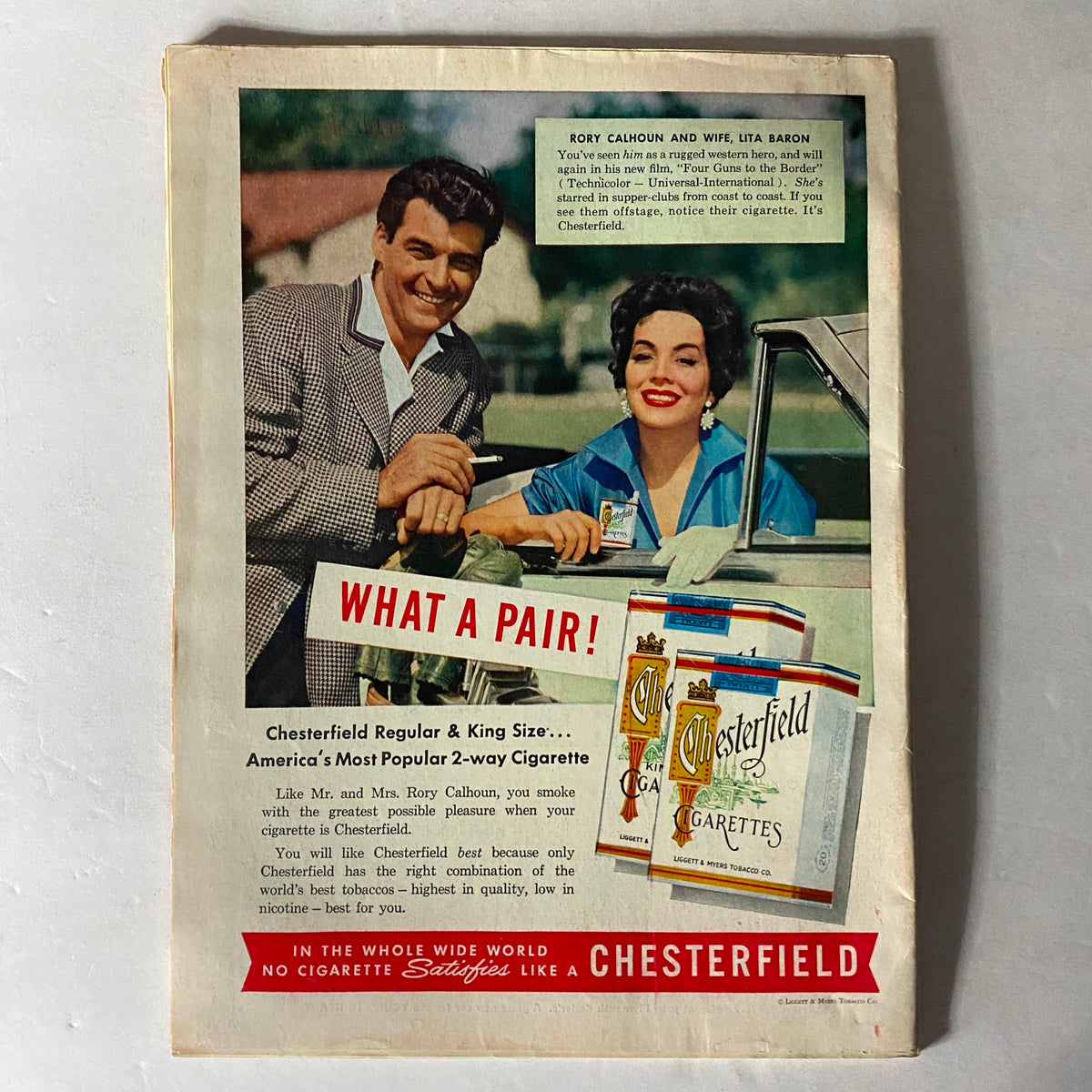 Vintage Chesterfield cigarette advertisement featuring Rory Calhoun and his wife Lita Baron. The ad promotes Chesterfield cigarettes as America's most popular 2-way cigarette, highlighting their lifestyle and nostalgic charm.