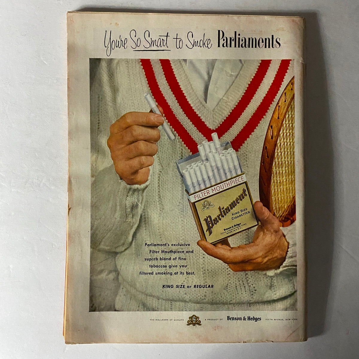 Vintage advertisement for Parliament cigarettes featuring a well-dressed individual holding a pack and cigarette, promoting the brand's filter mouthpiece, from Time Magazine May 9 1955 Vol 65 No. 19.