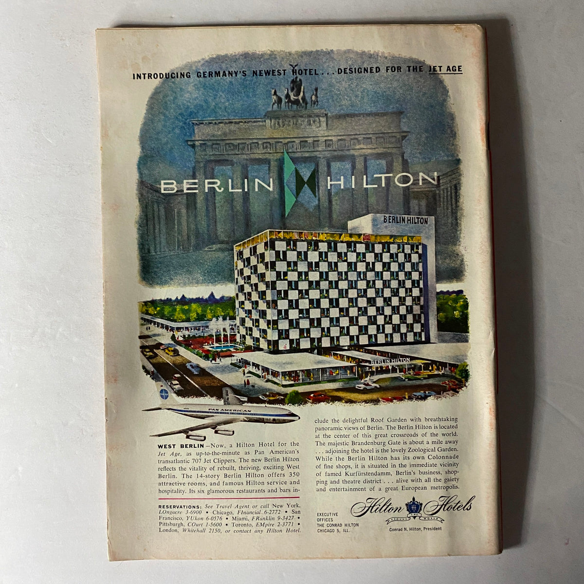 Advertisement for the Berlin Hilton hotel, introduced as Germany's newest hotel in the Time Magazine January 26 1959 issue, promoting modern amenities and scenic views.