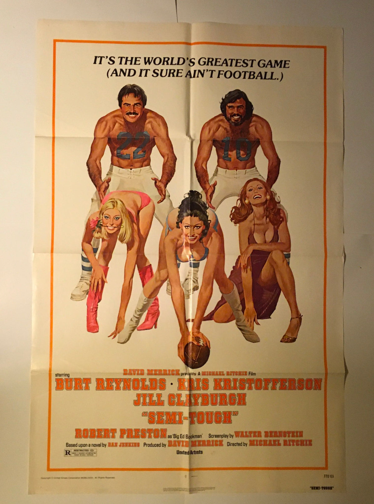 1977 Semi-Tough 41" x 27" Original Movie Poster highlighting Burt Reynolds, Kris Kristofferson, and Jill Clayburgh. The colorful artwork features actors in sporty poses, accompanied by glamorous models, reflecting the film's comedic themes.