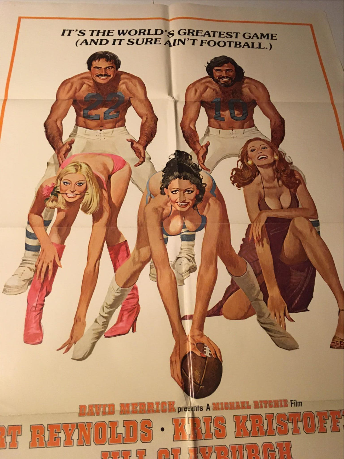 Full view of the 1977 Semi-Tough movie poster, displaying Burt Reynolds and co-stars in a vibrant comedic sports scene.