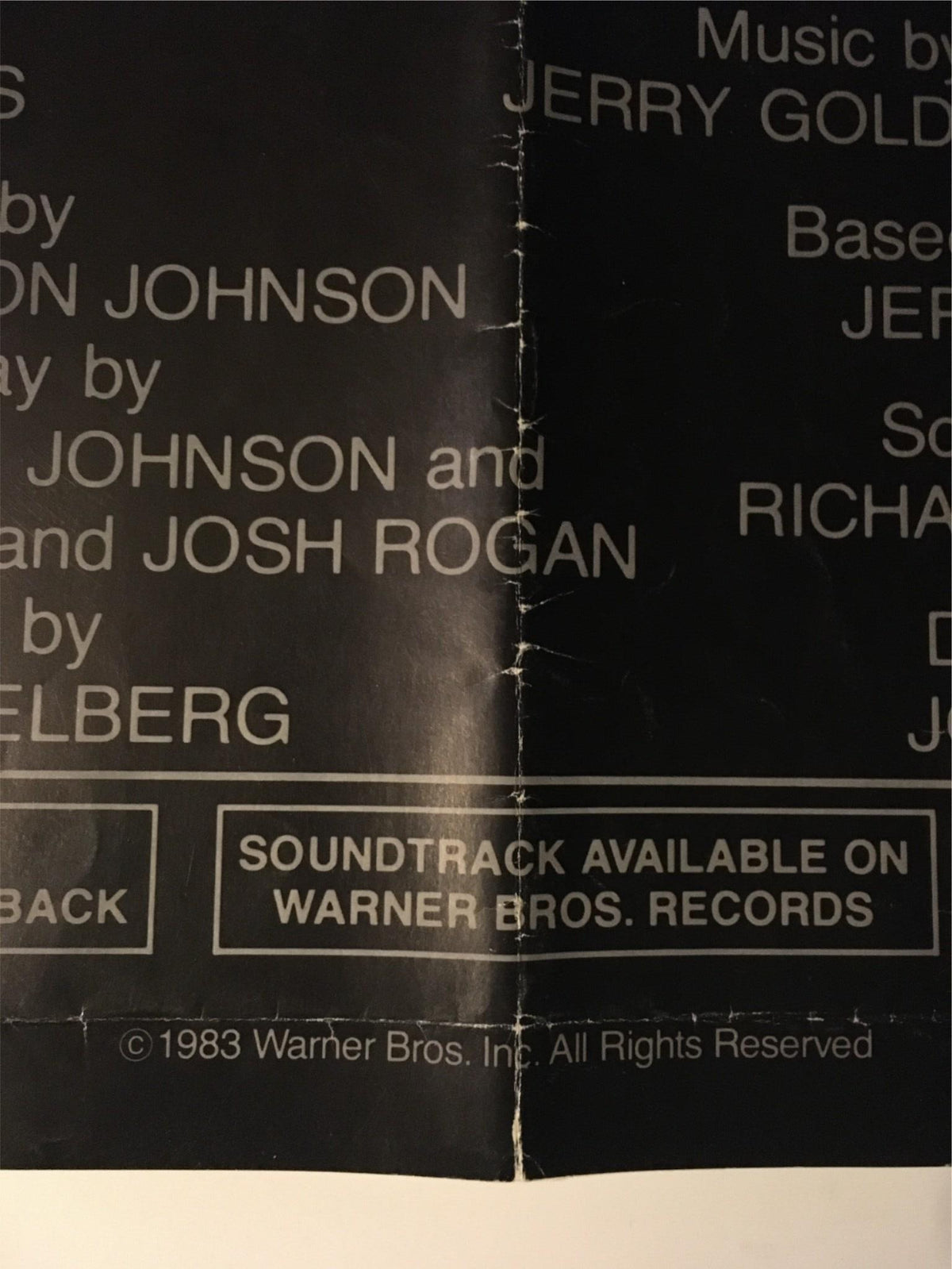 Close-up view of the credits section from the original movie poster of '1983 Twilight Zone: The Movie,' detailing cast and crew information.