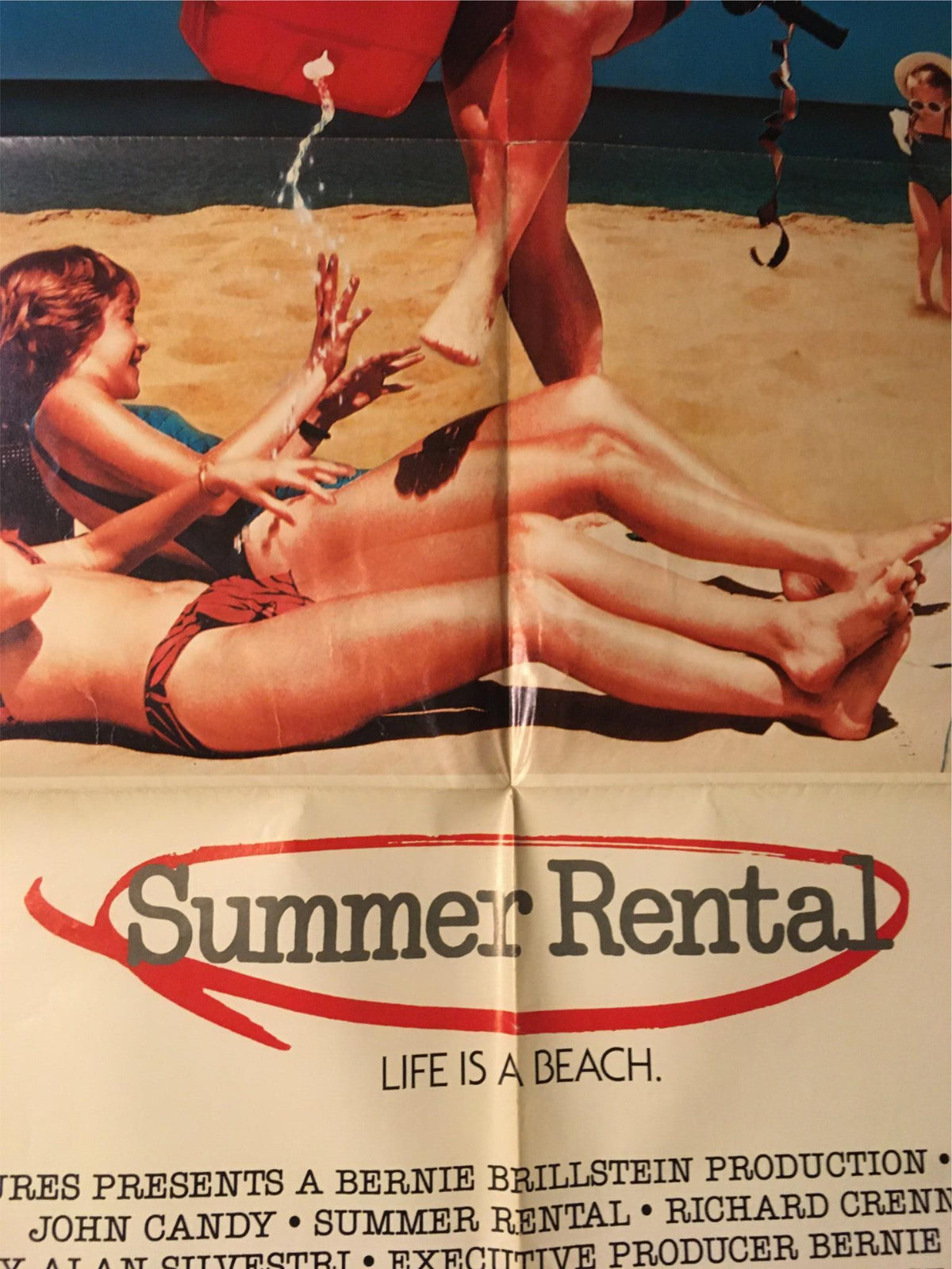 1985 Summer Rental 41" x 27" Original Movie Poster focusing on the title 'Summer Rental' and John Candy at the beach, emphasizing the carefree vacation lifestyle.