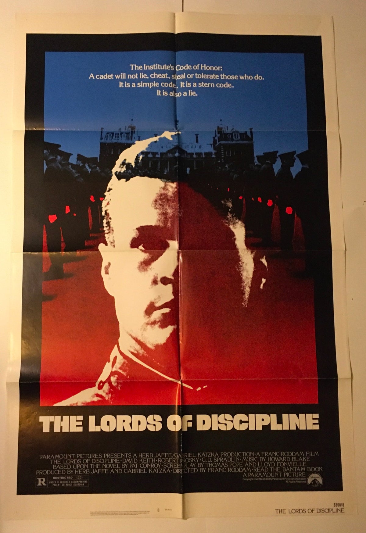 Close-up view of the 1983 The Lords of Discipline Original Movie Poster, showcasing the dramatic title and its iconic imagery. Vintage collectible piece in good condition.