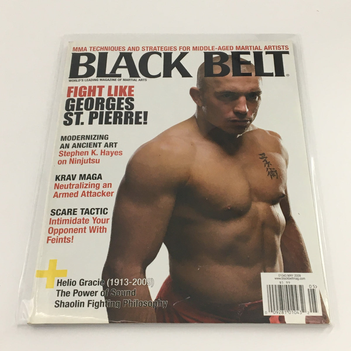 Black Belt Magazine May 2009 featuring the title 'Fight Like George St. Pierre', showcasing a muscular male martial artist on the cover, promoting MMA techniques and strategies for martial artists.