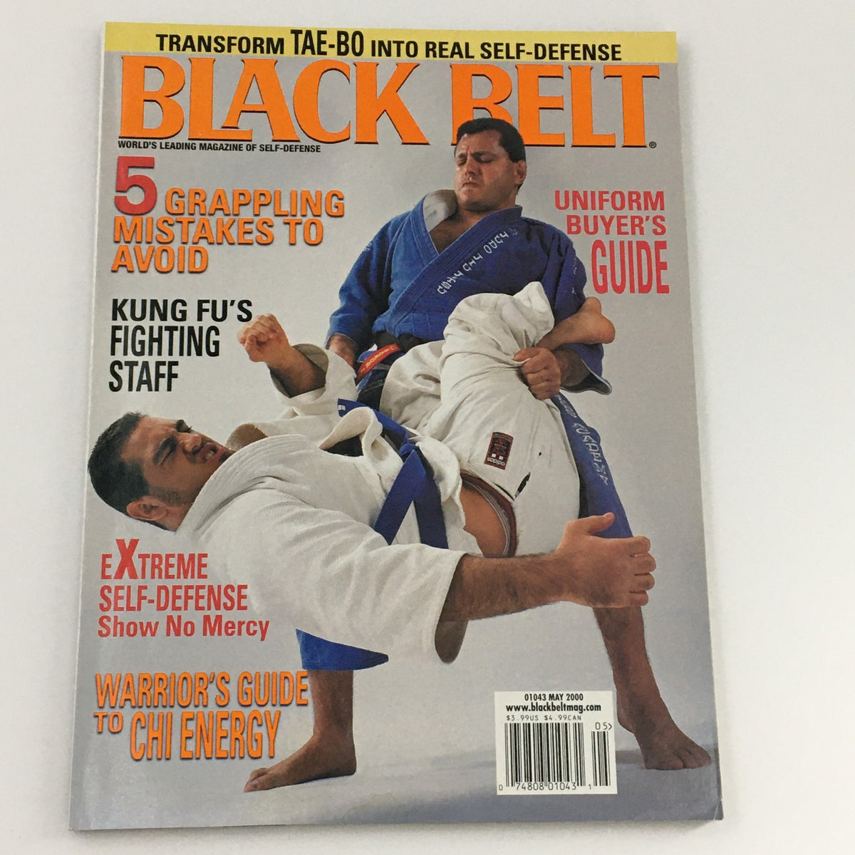 Cover of Black Belt Magazine May 2000, highlighting extreme self-defense techniques with martial artists demonstrating moves, emphasizing 'Uniform Buyer’s Guide' and 'Warrior’s Guide to Chi Energy'.