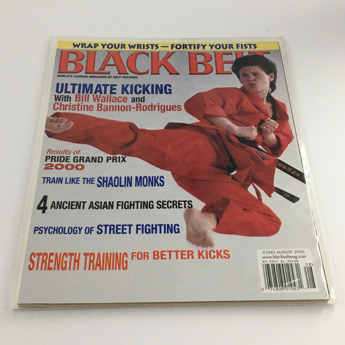 Cover of Black Belt Magazine August 2000 featuring Christine Bannon-Rodrigues demonstrating a kicking technique, highlighting her feature in Ultimate Kicking with Bill Wallace.