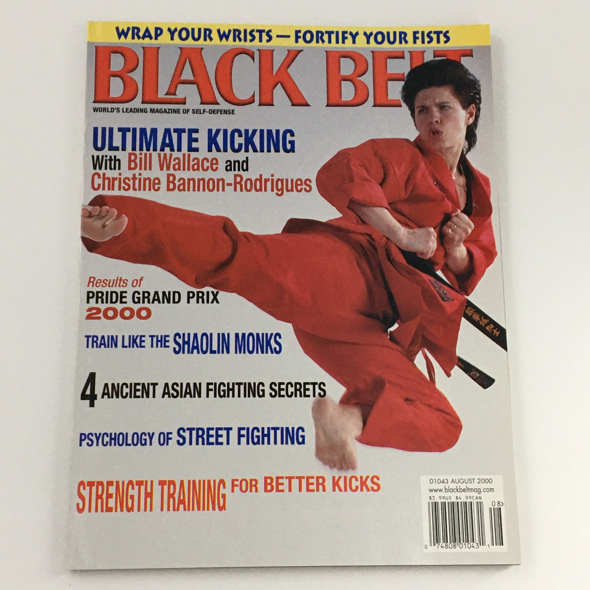 Cover of Black Belt Magazine August 2000 showcasing Christine Bannon-Rodrigues in a vibrant red karate uniform, emphasizing Ultimate Kicking alongside Bill Wallace.