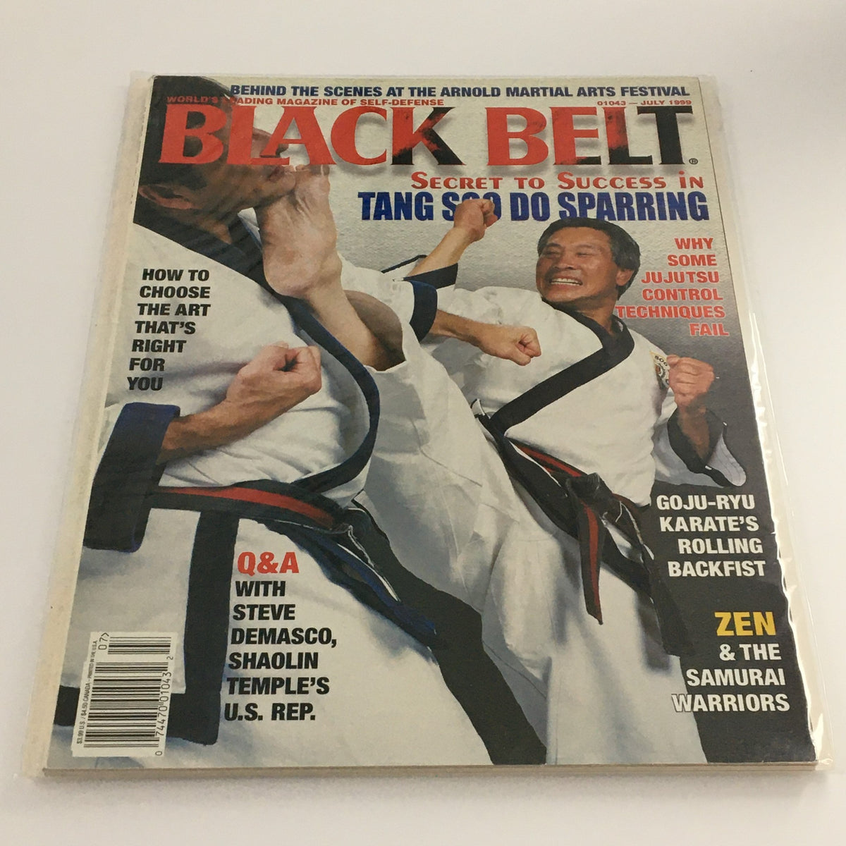 Cover of Black Belt Magazine July 1999 featuring an article on Goju-Ryu Karate's Rolling Backfist, illustrations of martial arts techniques, and highlights on the Tang Soo Do sparring.