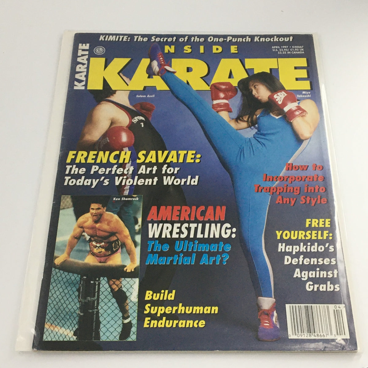Cover of Inside Karate Magazine, April 1997 edition featuring Salem Assli and Miya Takeuchi in a martial arts pose, highlighting articles on French Savate and American Wrestling.