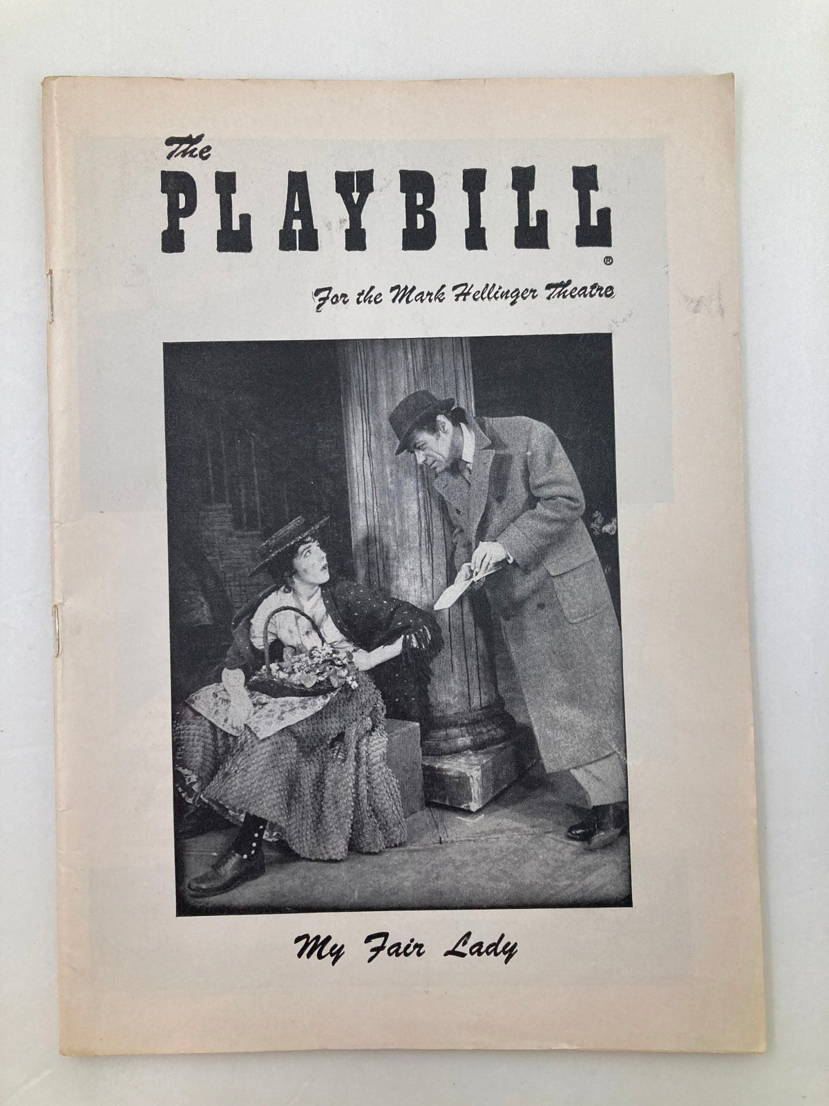 1957 Playbill for My Fair Lady featuring Rex Harrison and Julie Andrews at the Mark Hellinger Theatre, showcasing the front cover with a black and white image.