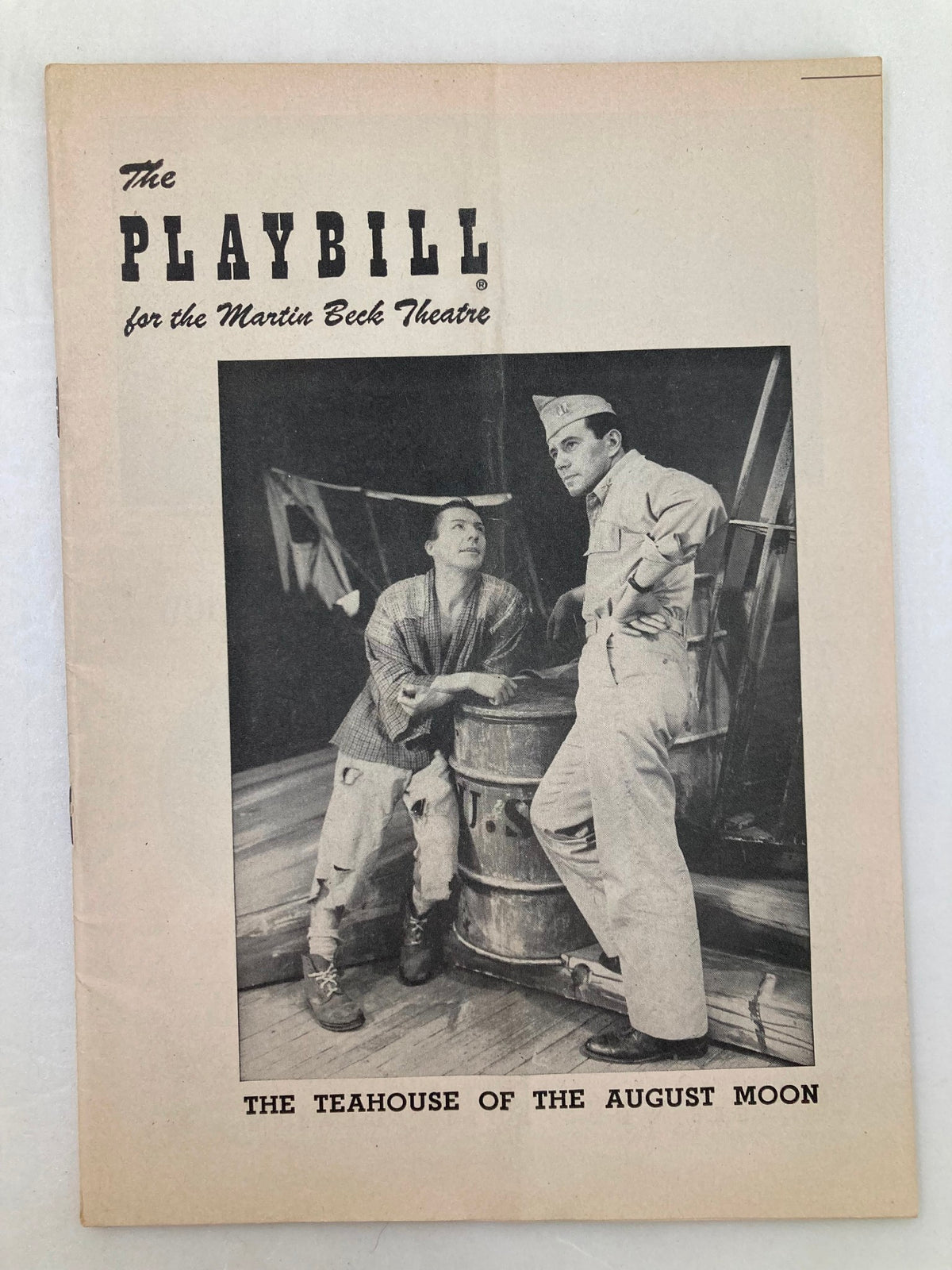 1954 Playbill for The Teahouse of the August Moon featuring a black and white photo of two male characters in theatrical attire, set in the Martin Beck Theatre.
