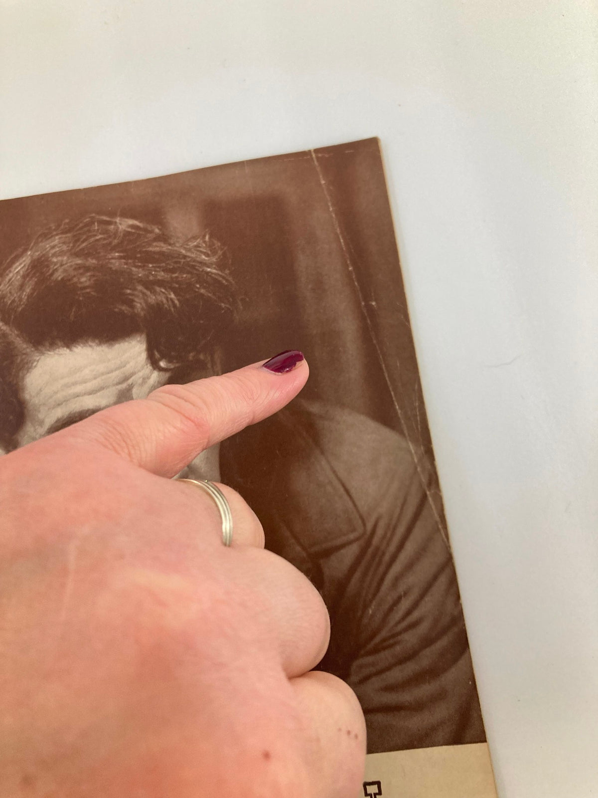 Close-up view of a vintage 1939 Playbill from the Ethel Barrymore Theatre featuring Paul Muni and Jose Ferrer in Key Largo, highlighting a hand pointing at the cover.