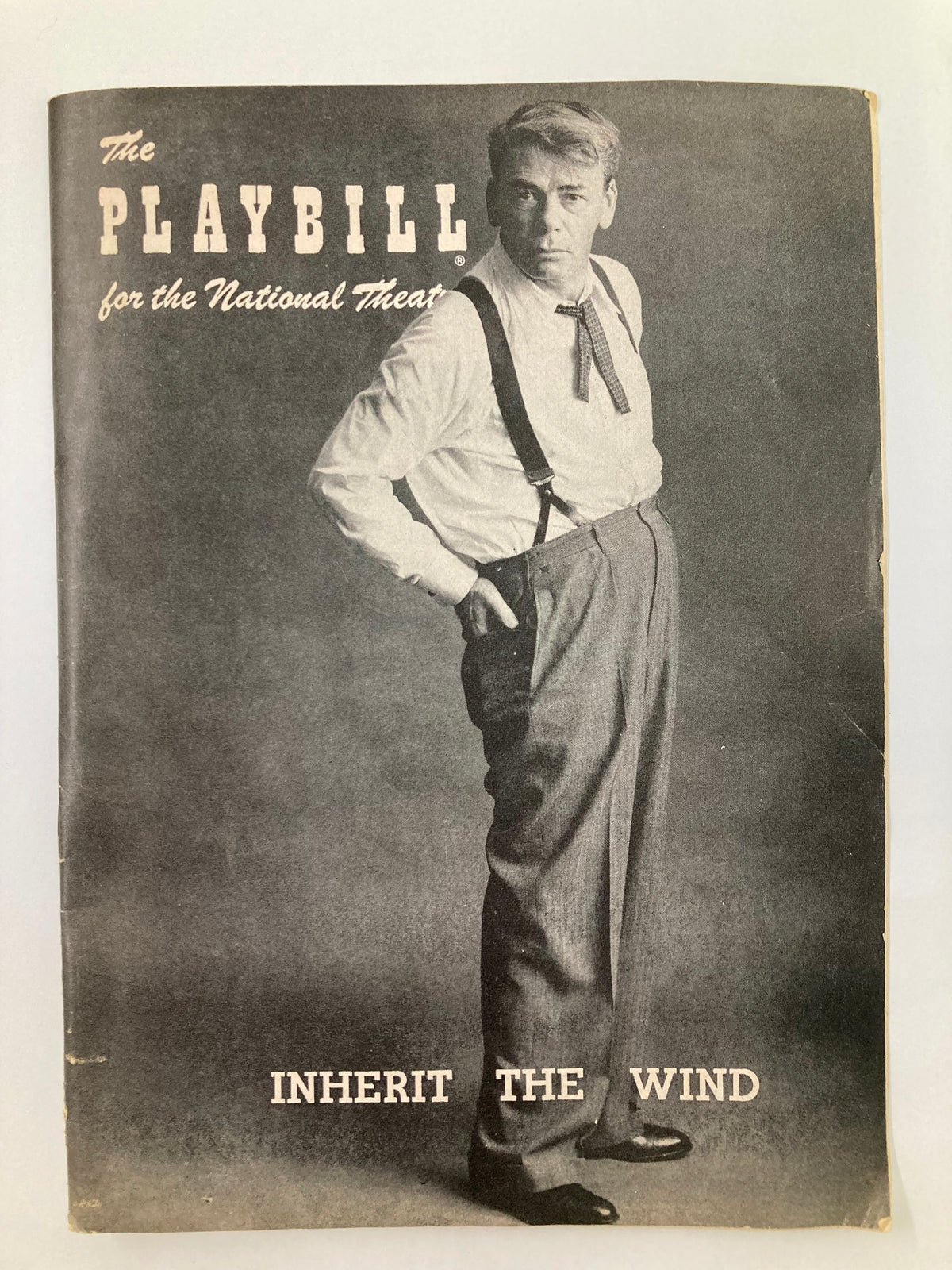 1957 Playbill for the National Theatre featuring Paul Muni in 'Inherit the Wind,' showcasing a classic theatrical portrait.