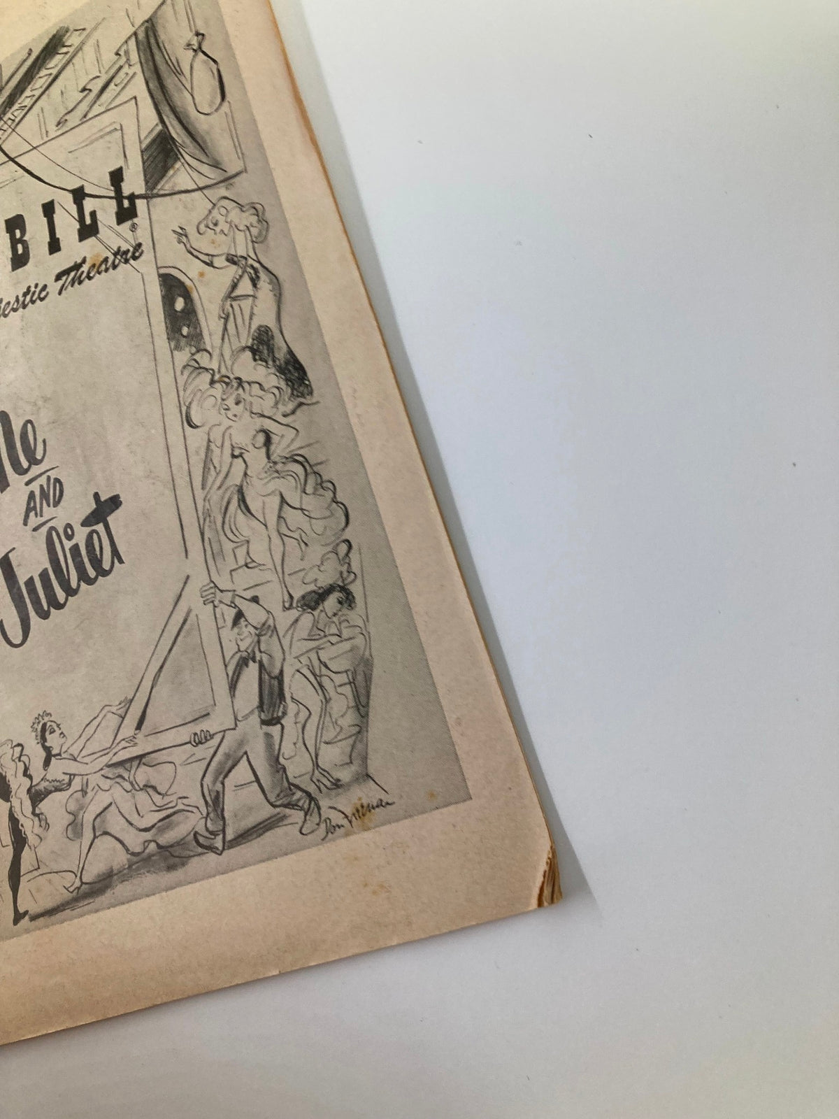 Detailed view of the corner of the 1953 Playbill for 'Me and Juliet' showcasing the artistic design and vintage condition.