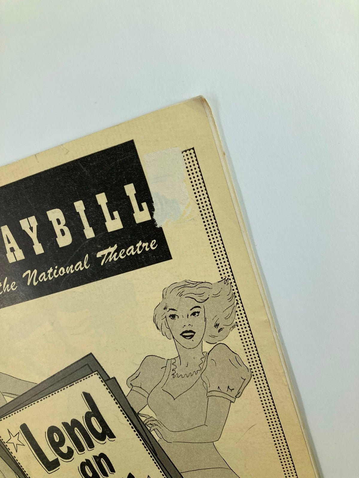Close-up view of the 1948 Playbill National Theatre for Lend An Ear, highlighting the title and elegant illustration of actress Yvonne Adair.