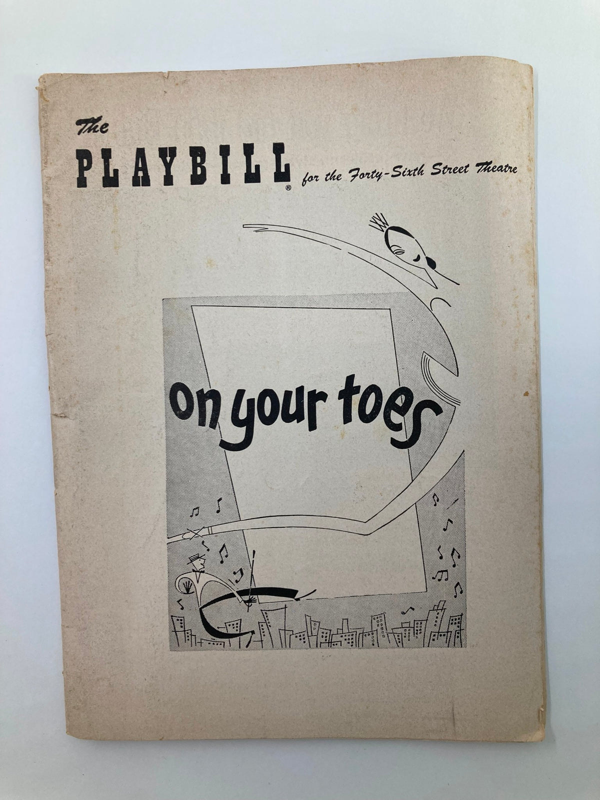 1954 Playbill for the 46th Street Theatre featuring the title "On Your Toes" with vintage illustrations, showcasing a moment in Broadway history.