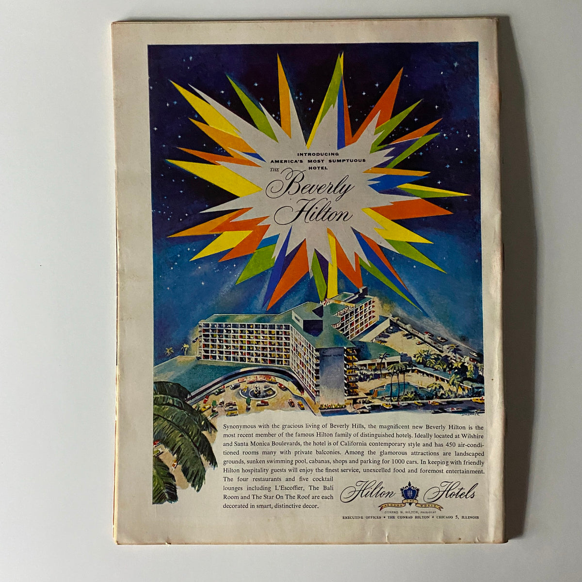 Back cover of Time Magazine from August 15, 1955, showcasing an advertisement for the Beverly Hilton Hotel with vibrant graphics, reflecting mid-century modern design.