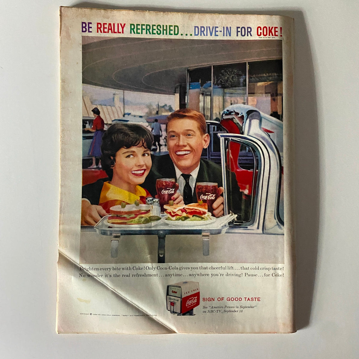 Cover of Time Magazine September 14, 1959, Vol 74 No. 11 featuring a vibrant advertisement for Coca-Cola, showcasing a smiling couple enjoying food and drinks at a drive-in restaurant.