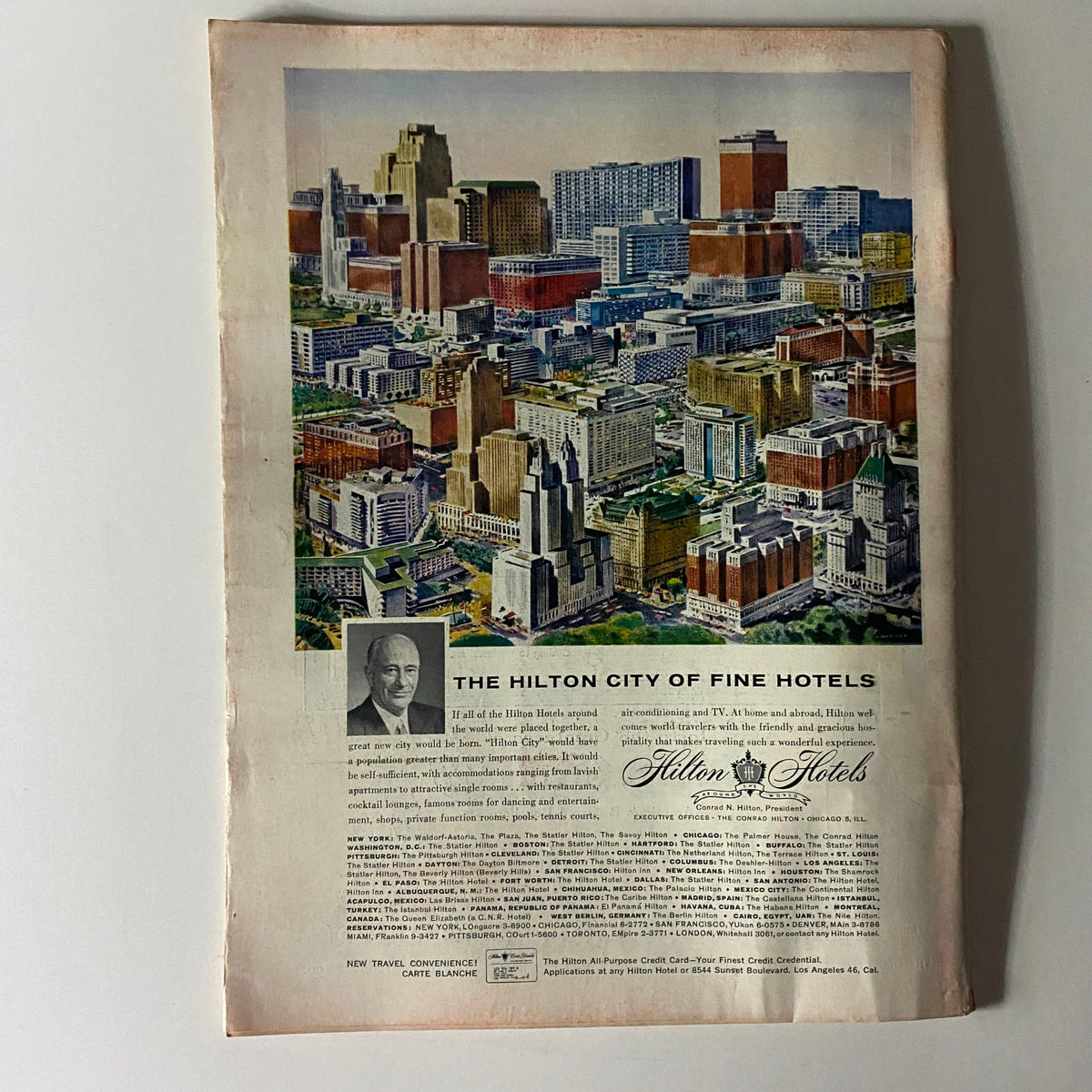 Back cover advertisement of Time Magazine, October 5, 1959, featuring a colorful aerial view of city hotels and a promotional section for Hilton Hotels.