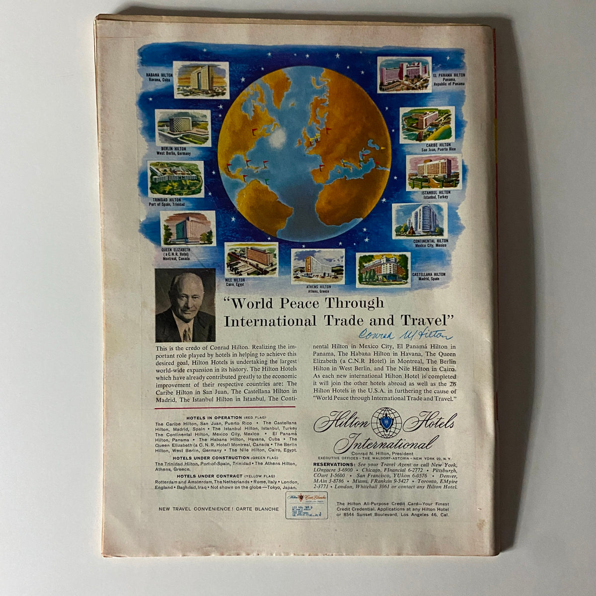 Back cover of Time Magazine from June 15, 1959, showcasing a colorful illustration centered on global trade and travel, promoting Hilton Hotels. The edition belongs to Volume 73, Number 24 featuring Lewis Strauss on the front.