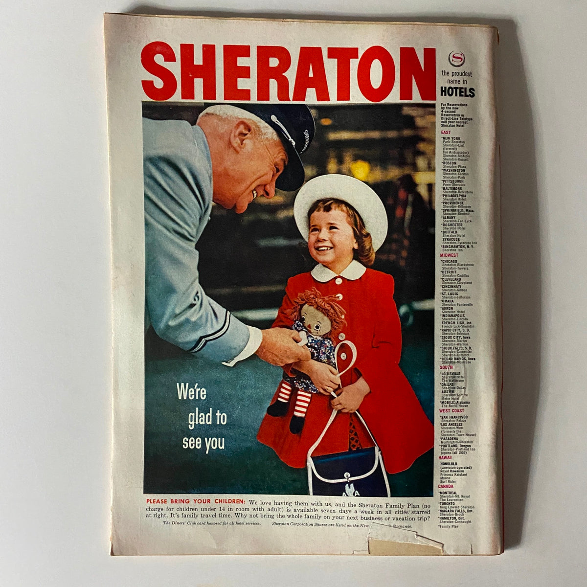 Vintage Sheraton Hotels advertisement featuring a smiling girl with a doll and a hotel staff member, illustrating family-friendly hospitality and charm.