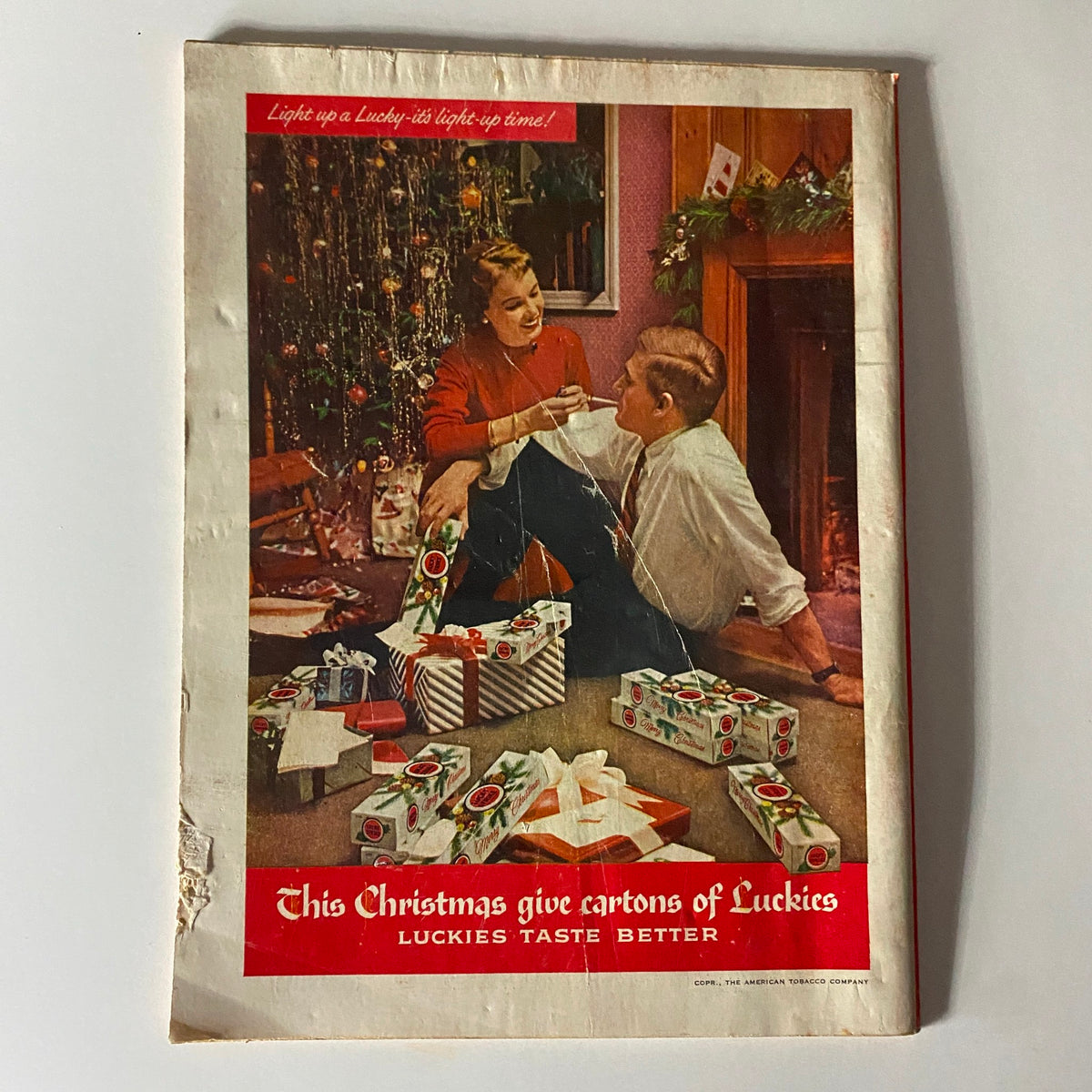 Cover of Time Magazine December 12, 1955, Vol 66 No. 24 featuring a festive Christmas scene with a woman dressed in a red sweater and a man talking near a fireplace, surrounded by wrapped gifts and decorations.