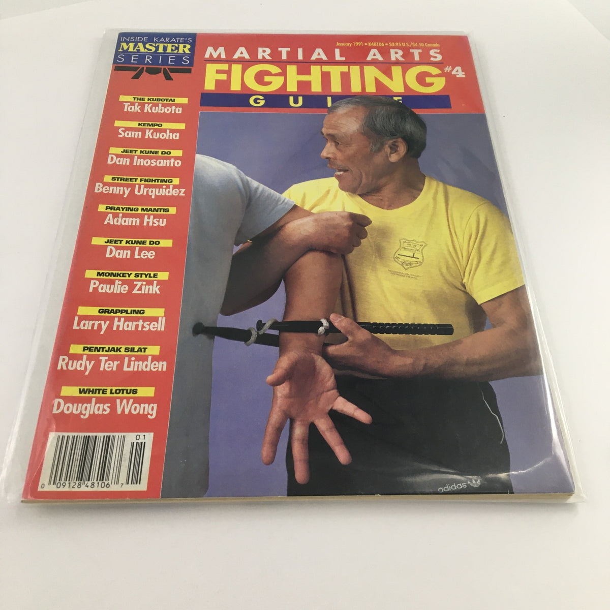 Cover of 'Martial Arts Fighting Guide January 1991' featuring Tak Kubota demonstrating martial arts techniques, with additional contributors listed. The magazine is bagged and boarded in excellent condition.