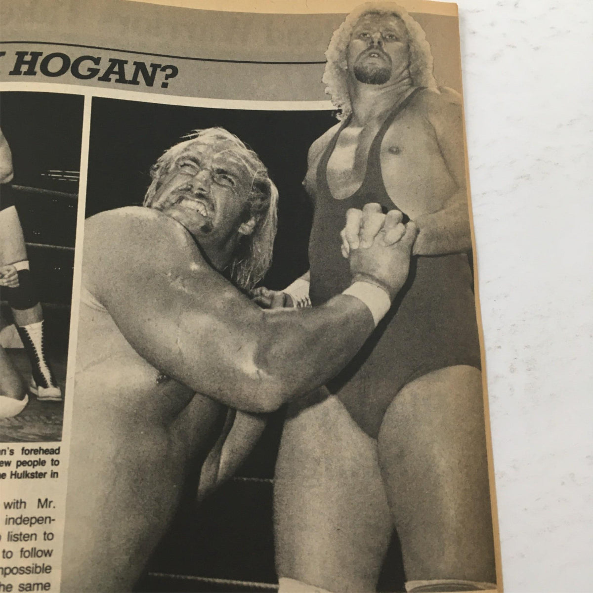Black and white image from Inside Wrestling Magazine July 1985 featuring Hulk Hogan in a wrestling match, capturing the intensity of the sport.