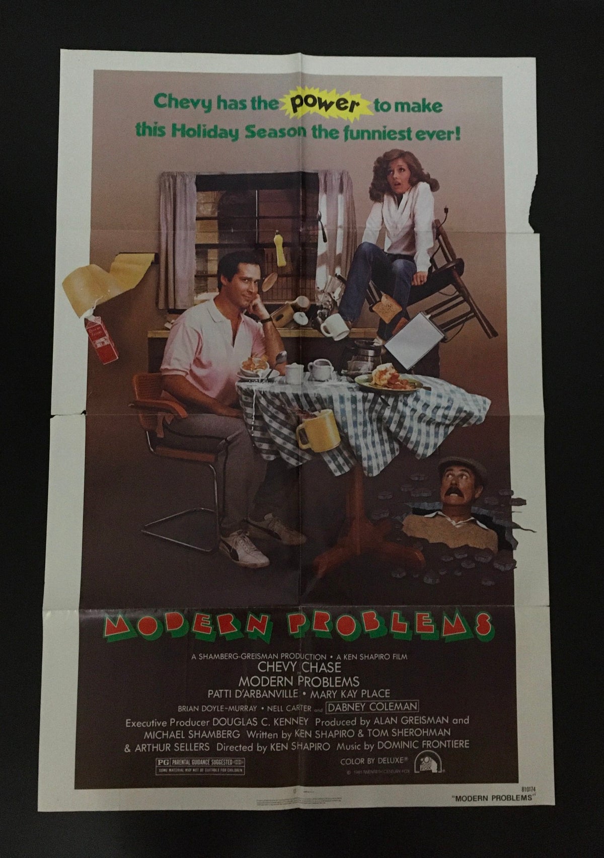 1981 Modern Problems 41" x 27" Original Movie Poster featuring Chevy Chase at a dining table with comedic elements.