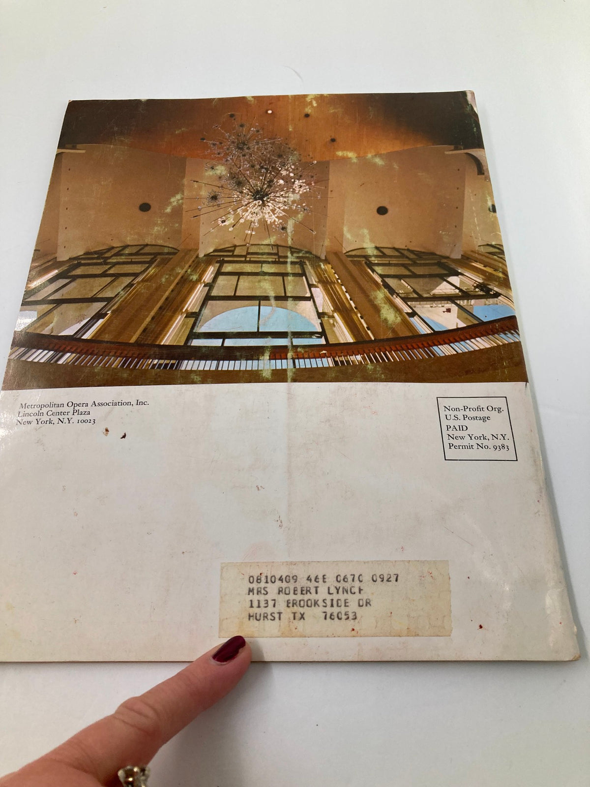 Back cover of the 1968 Program Souvenir Metropolitan Opera Association Annual Report, featuring a view of the chandelier and interior of the Metropolitan Opera House, along with an address label.