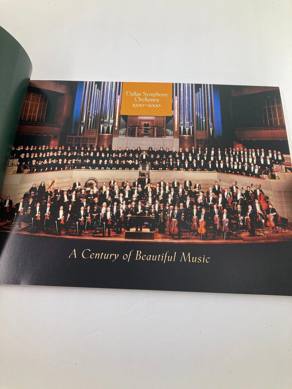 Inside page of the 2000 Program Souvenir Dalla Symphony Orchestra showcasing a large orchestra ensemble with the title 'A Century of Beautiful Music'.