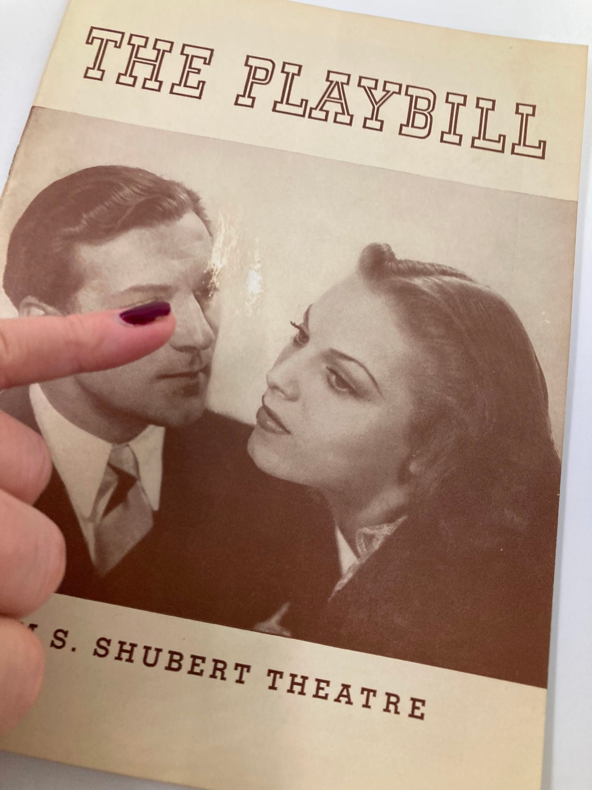 1939 Playbill showcasing Dennis King in I Married An Angel, cover image focused on two characters with a finger pointing at their faces, Sam S. Shubert Theatre.