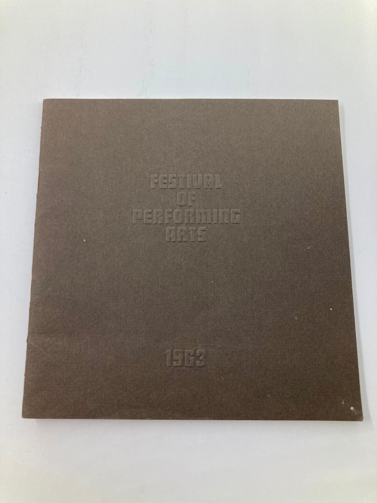 Cover of the 1963 Souvenir Program for the Festival of Performing Arts, showcasing the title in embossed lettering.