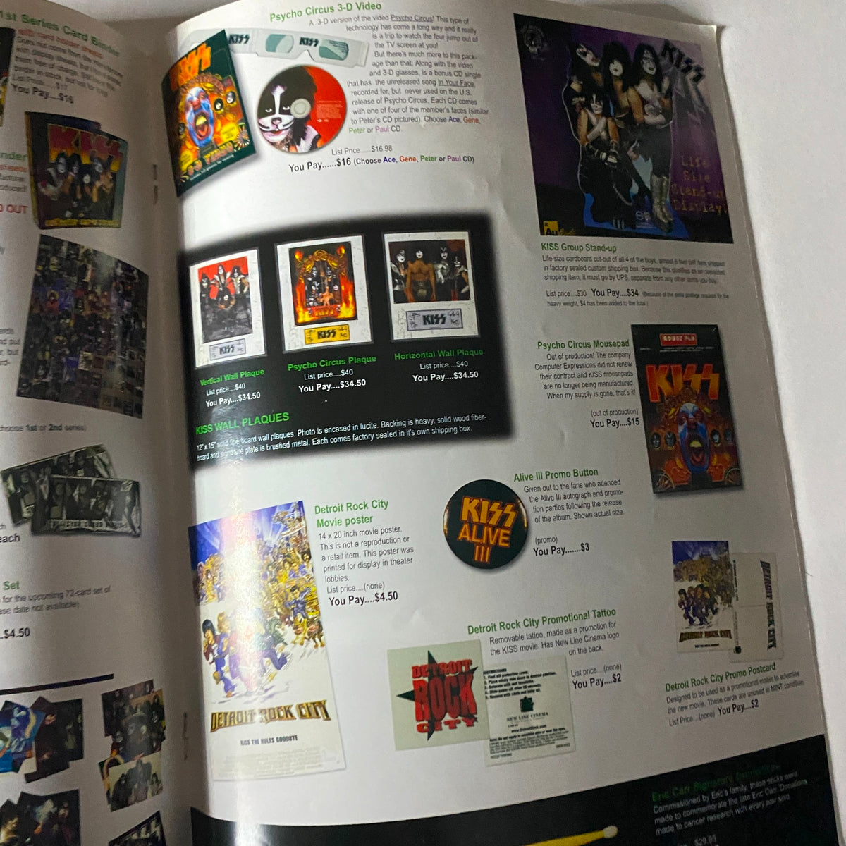 Inside view of the KISS Museum.com Catalog Christmas and New Year's 2000, showcasing collectible KISS items including CDs and promotional materials.