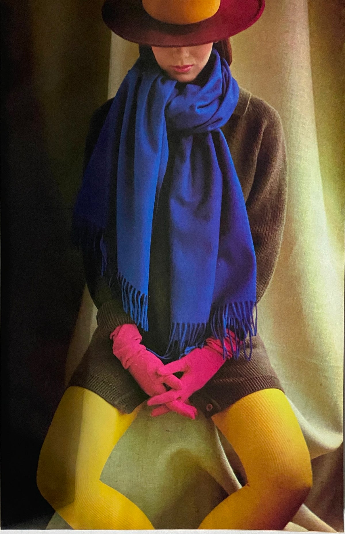 Fashion spread from Glamour Magazine September 1983 featuring a model dressed in vibrant colors with a blue scarf and pink gloves, showcasing 1980s style.