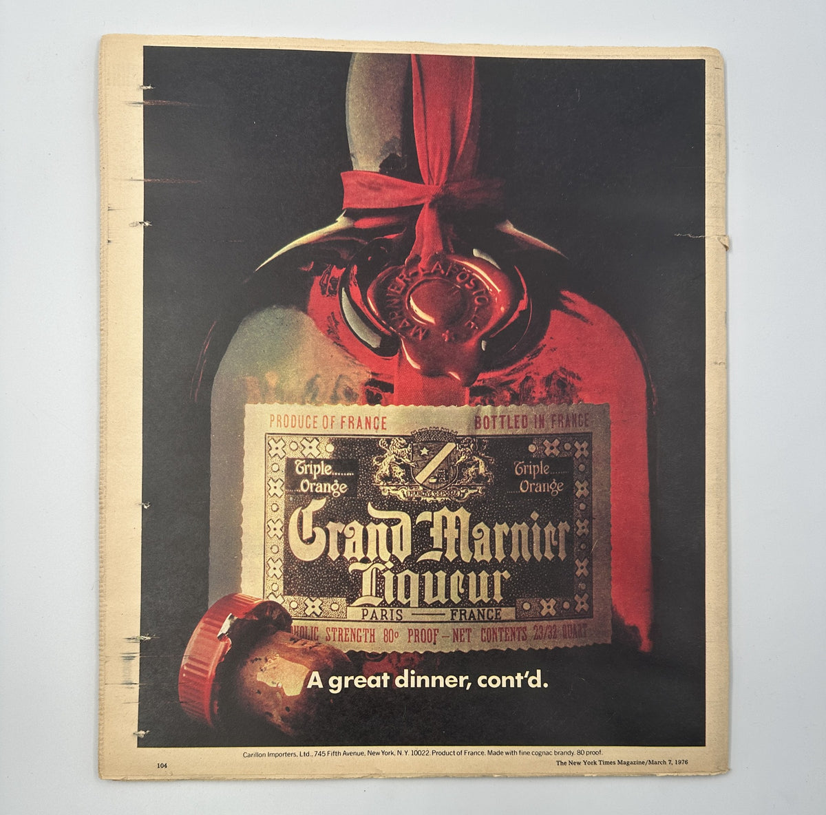 Back cover of The New York Times Magazine March 7, 1976 showcasing a bottle of Grand Marnier Liqueur with the caption 'A great dinner, cont'd.'