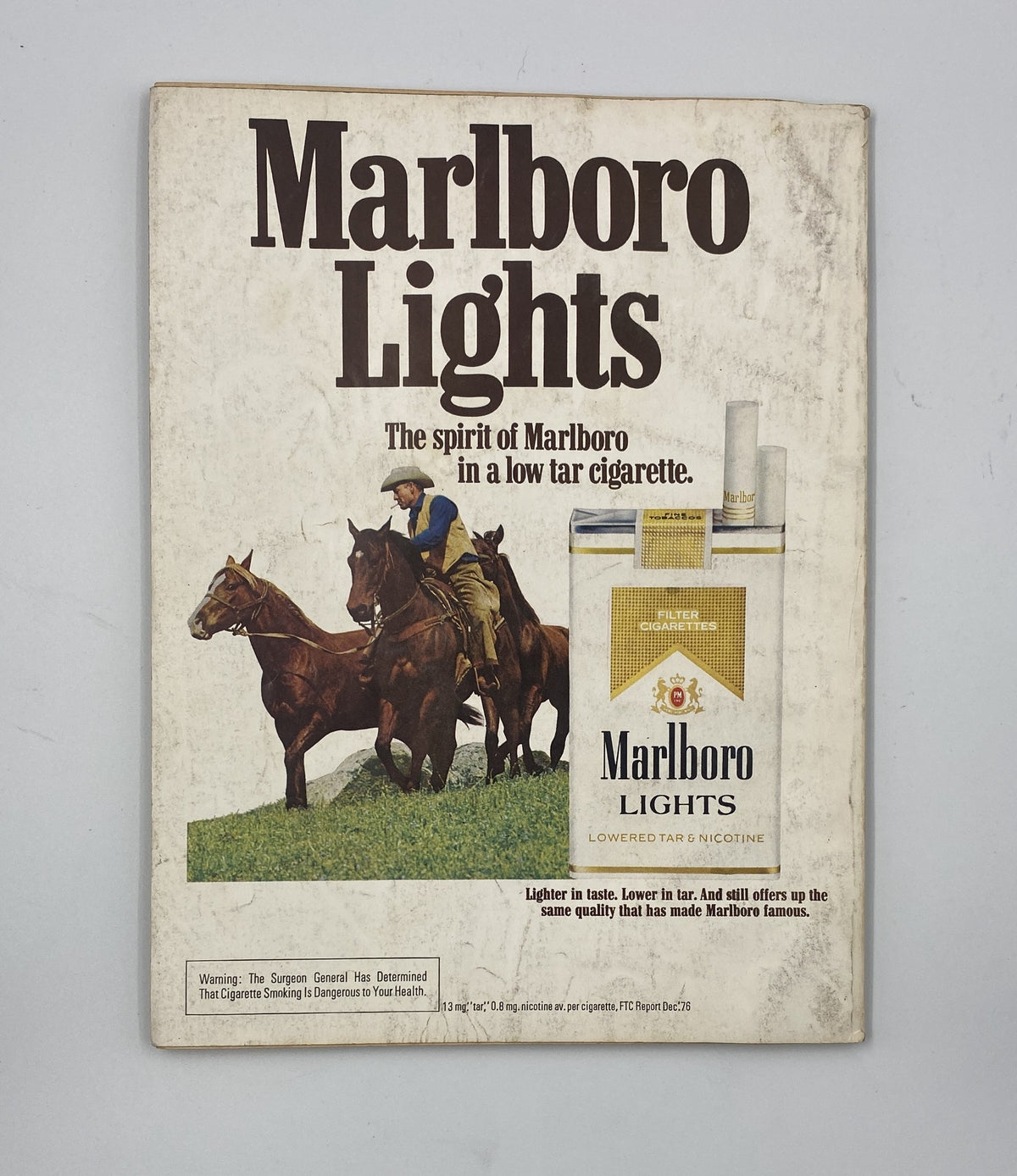 Marlboro Lights advertisement featuring a cowboy on horseback promoting Marlboro cigarettes, highlighting the product's low tar and nicotine content. Image relates to the Esquire Magazine August 1977 issue, which includes a feature on swimming and celebrity insights.
