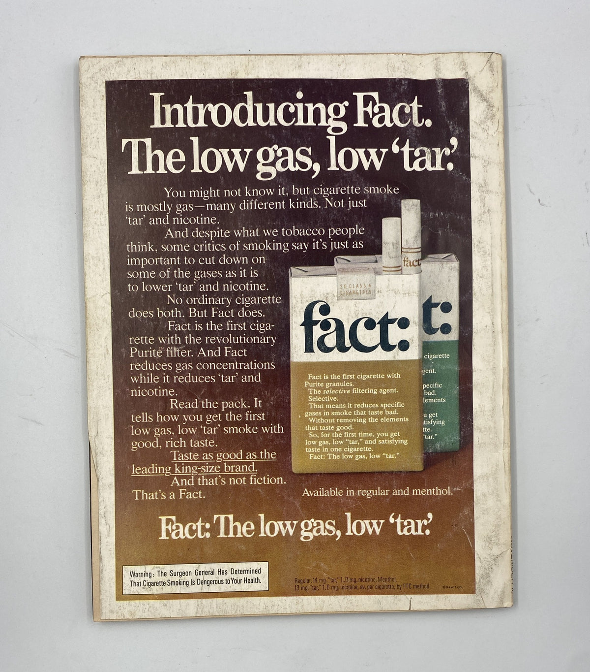 Back cover of Esquire Magazine November 1976 displaying an advertisement for Fact cigarettes, promoting their low gas and low tar features.