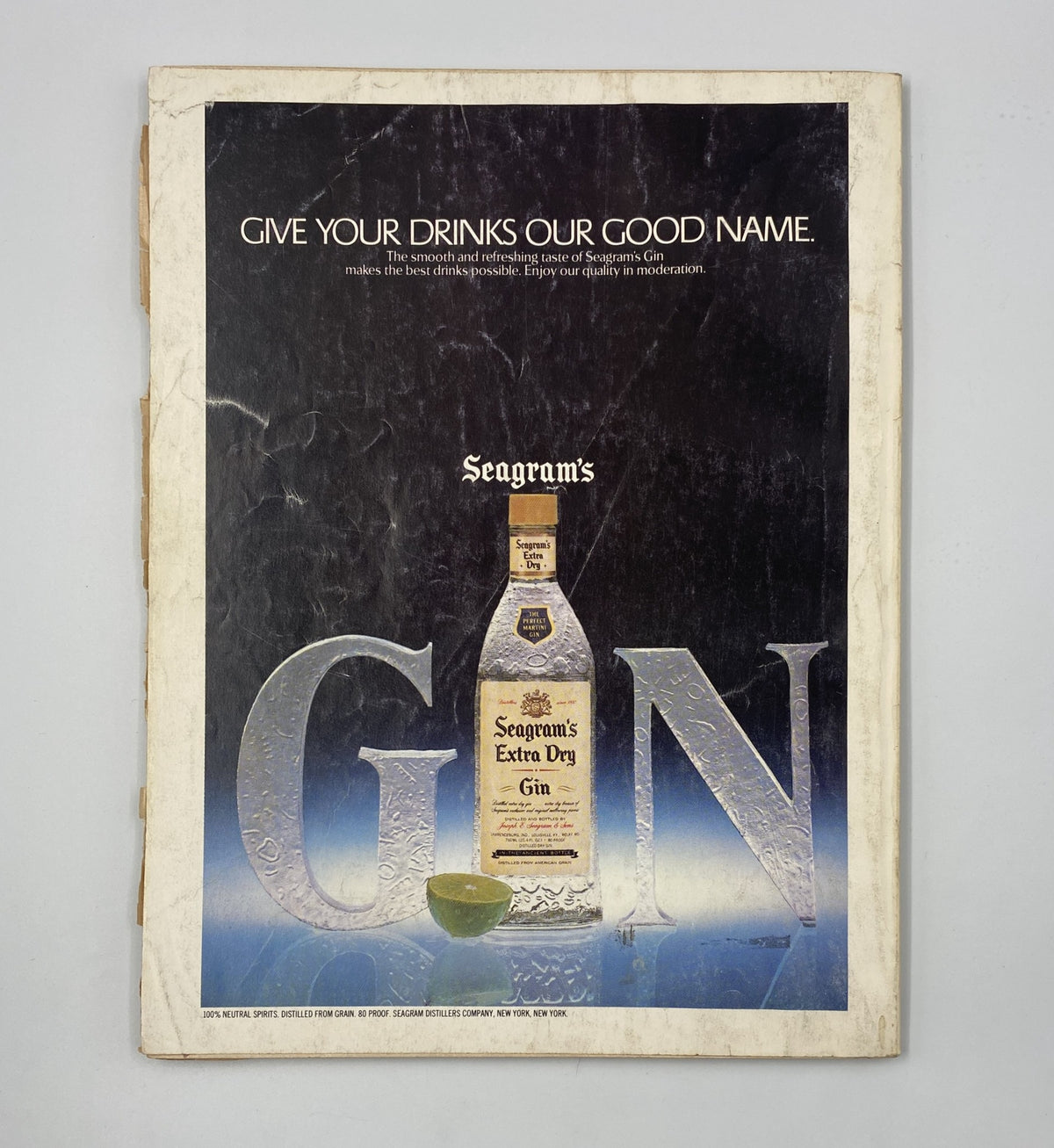 Esquire Magazine December 1980 features an advertisement for Seagram's Gin, showcasing the bottle against a backdrop that emphasizes the product's quality.
