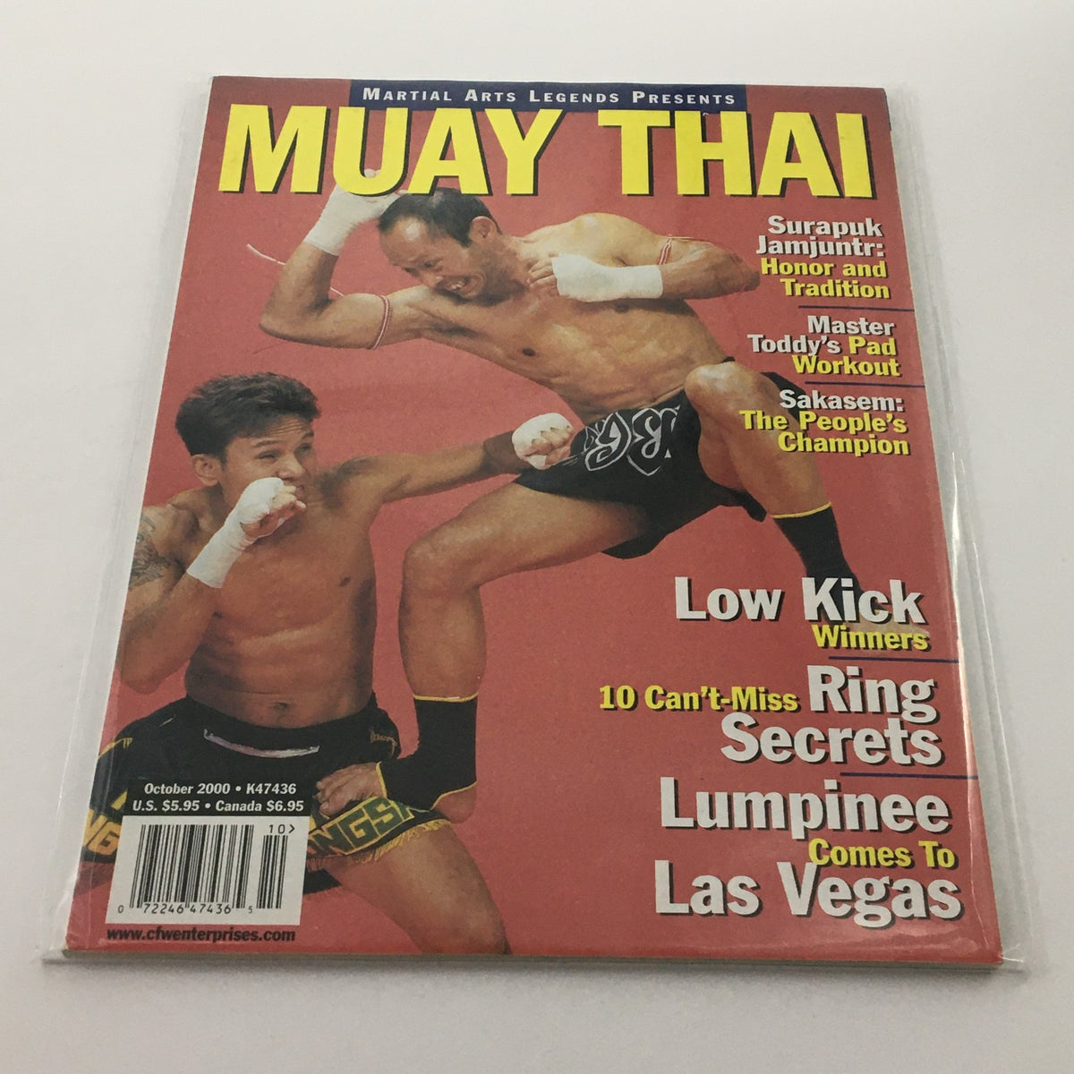 Martial Arts Legends Muay Thai magazine cover, October 2000 edition featuring Surapuk Jamjuntr, highlighting techniques and traditions in Muay Thai, including content on low kick winners and the transition of Lumpinee to Las Vegas.
